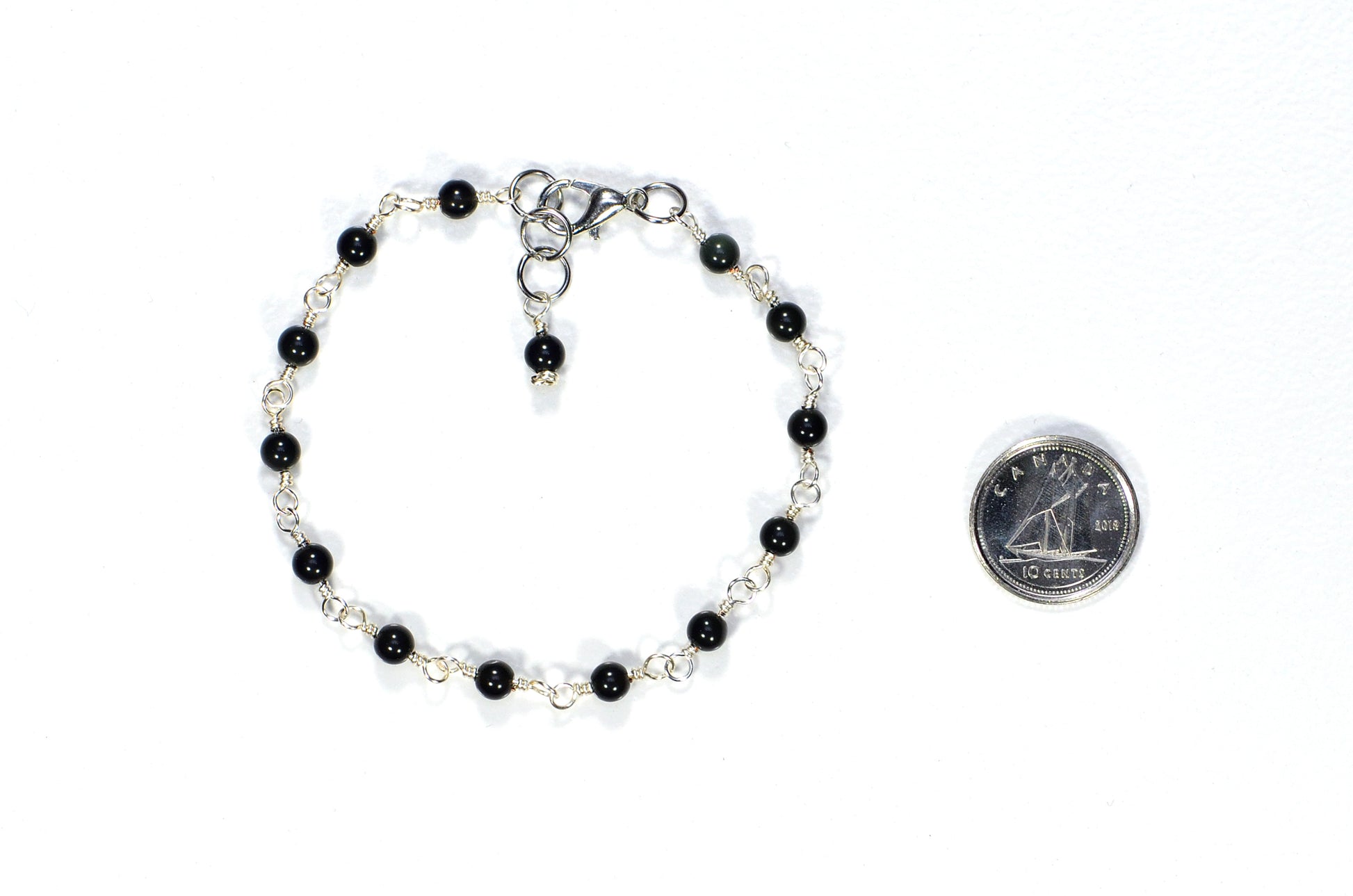 4mm Black Obsidian Link Chain Anklet beside a dime.