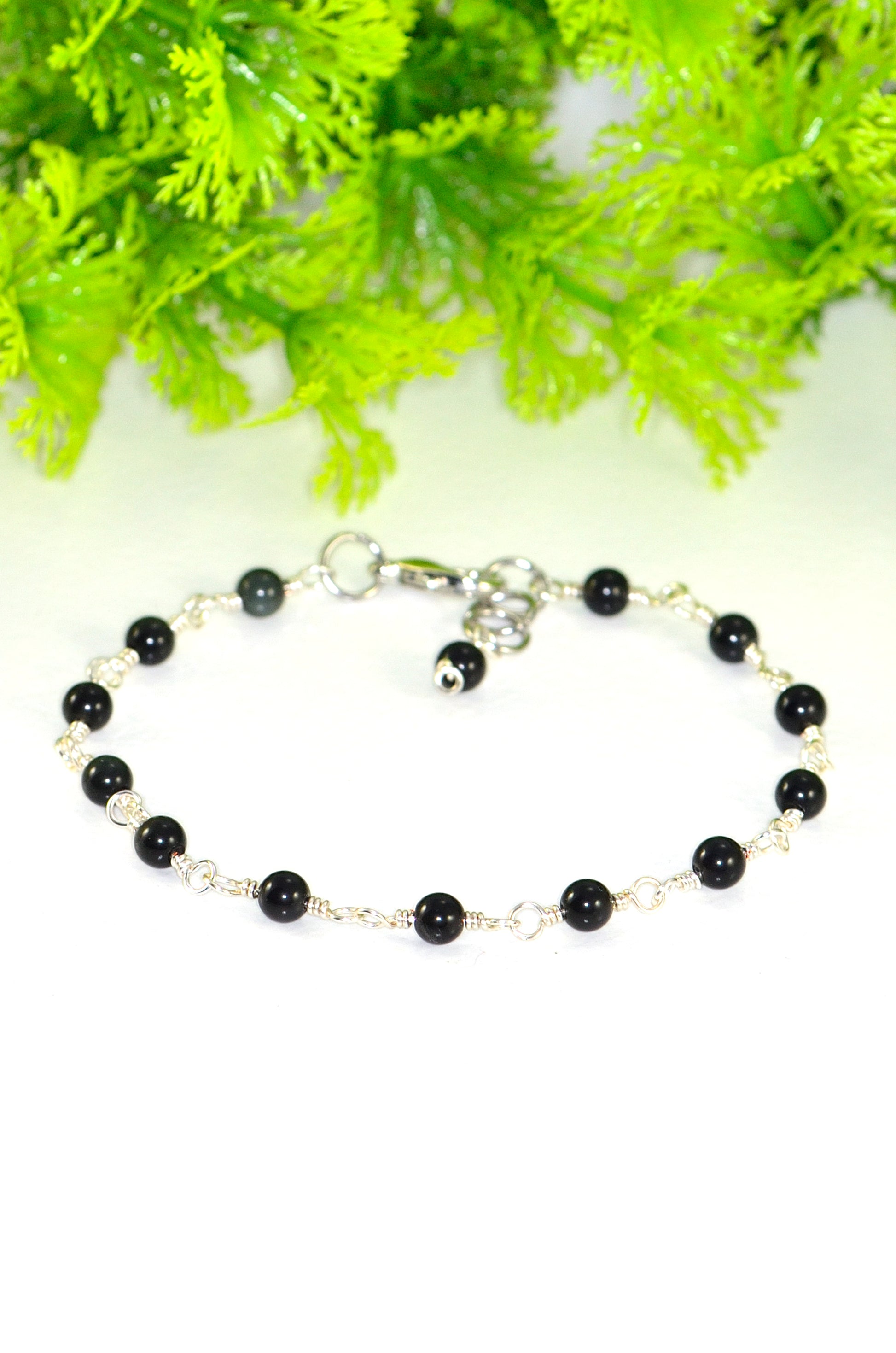 Close up of 4mm Black Obsidian Link Chain Anklet.