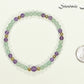 4mm Green Aventurine and Amethyst Bracelet beside a dime.
