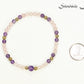 4mm Rose Quartz and Amethyst Bracelet beside a dime.