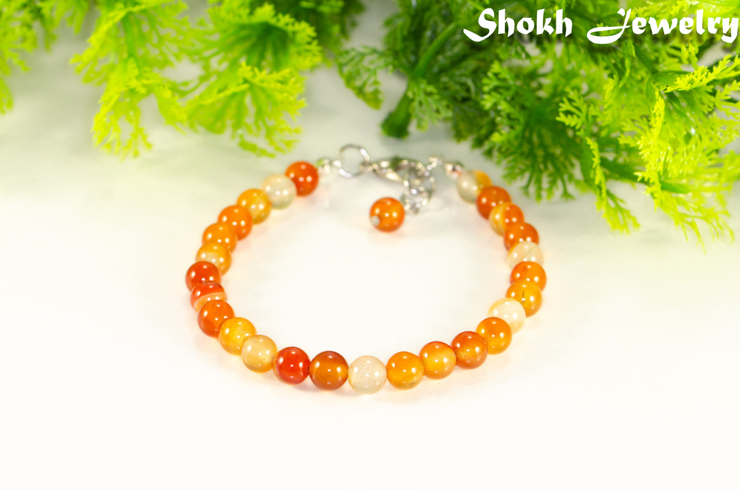 6mm Carnelian Crystal Bracelet with clasp and a dangle.