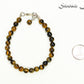 6mm Tiger's Eye Beaded Bracelet beside a dime.