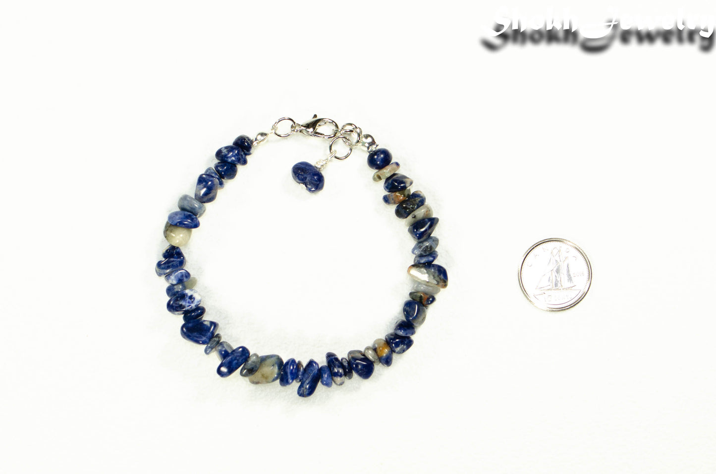 Natural Sodalite Chip Bracelet beside a dime.