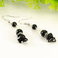 Close up of Long Black Obsidian Crystal Chip Earrings.
