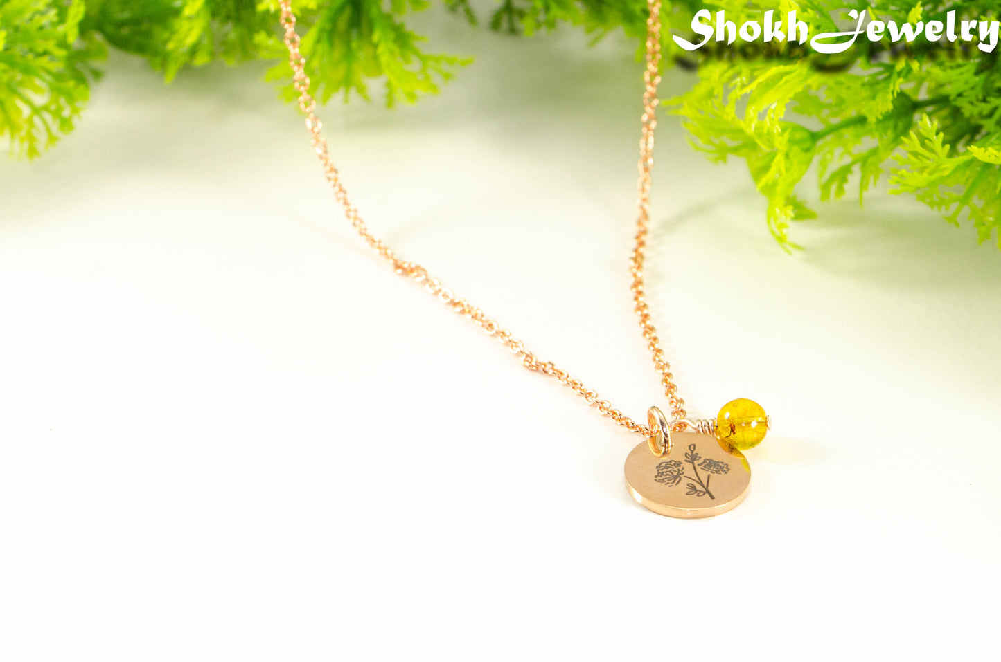 Close up of Rose Gold Plated November Birth Flower Necklace with Citrine Birthstone Pendant.