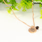 Close up of Rose Gold Plated January Birth Flower Necklace with Garnet Birthstone Pendant.