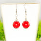 Close up of 12mm Red Howlite Dangle Earrings.