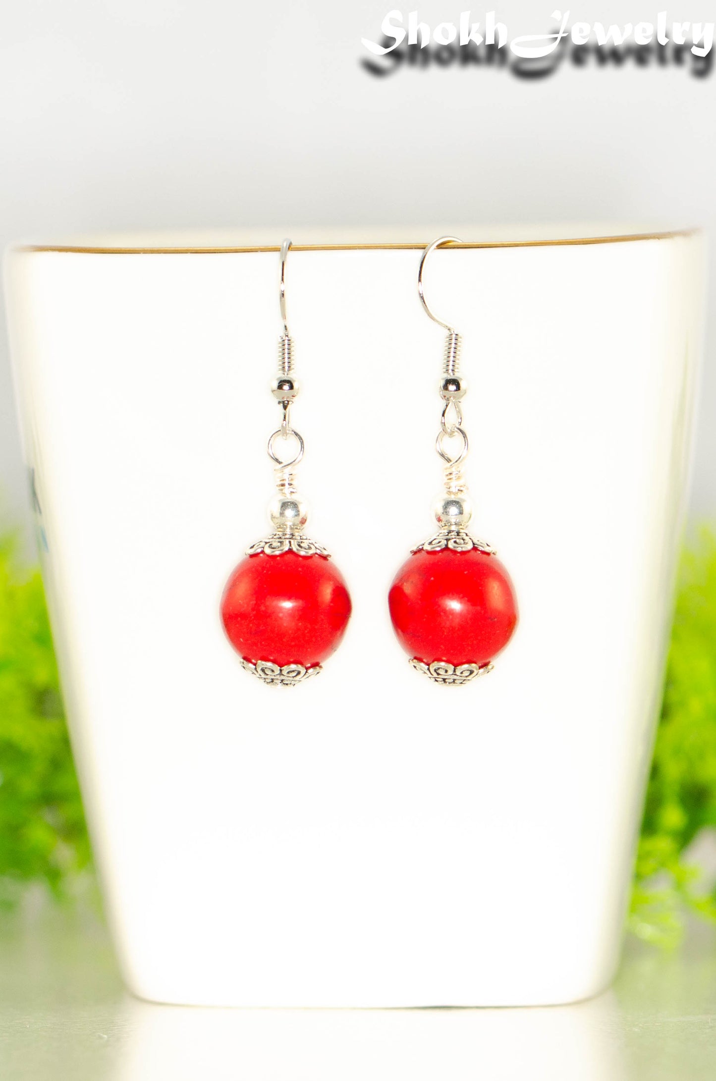 Close up of 12mm Red Howlite Dangle Earrings.