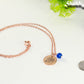 Rose Gold Plated September Birth Flower Necklace with Sapphire Birthstone Pendant beside a dime.