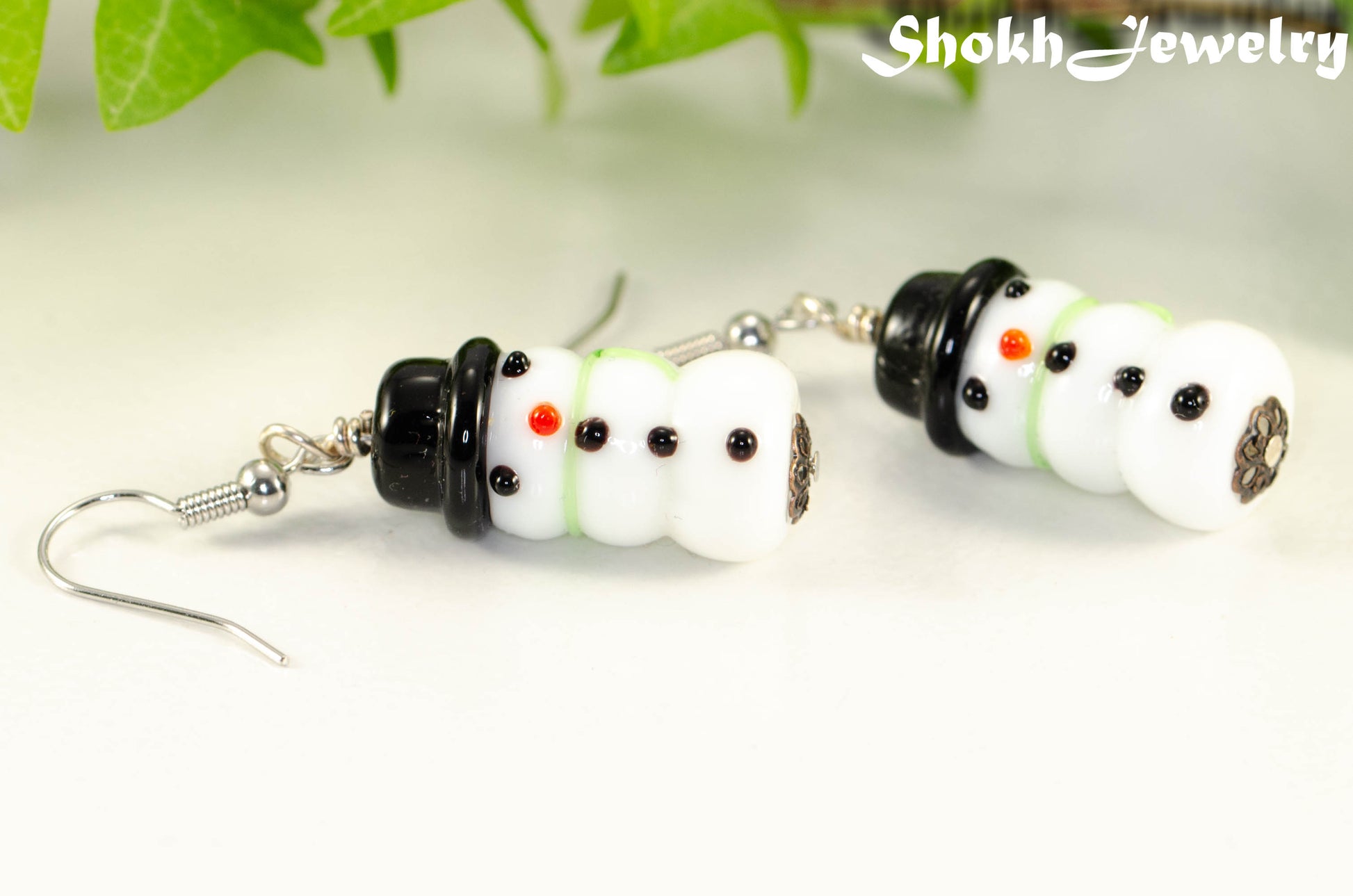 Close up of Snowman Glass Bead Earrings.