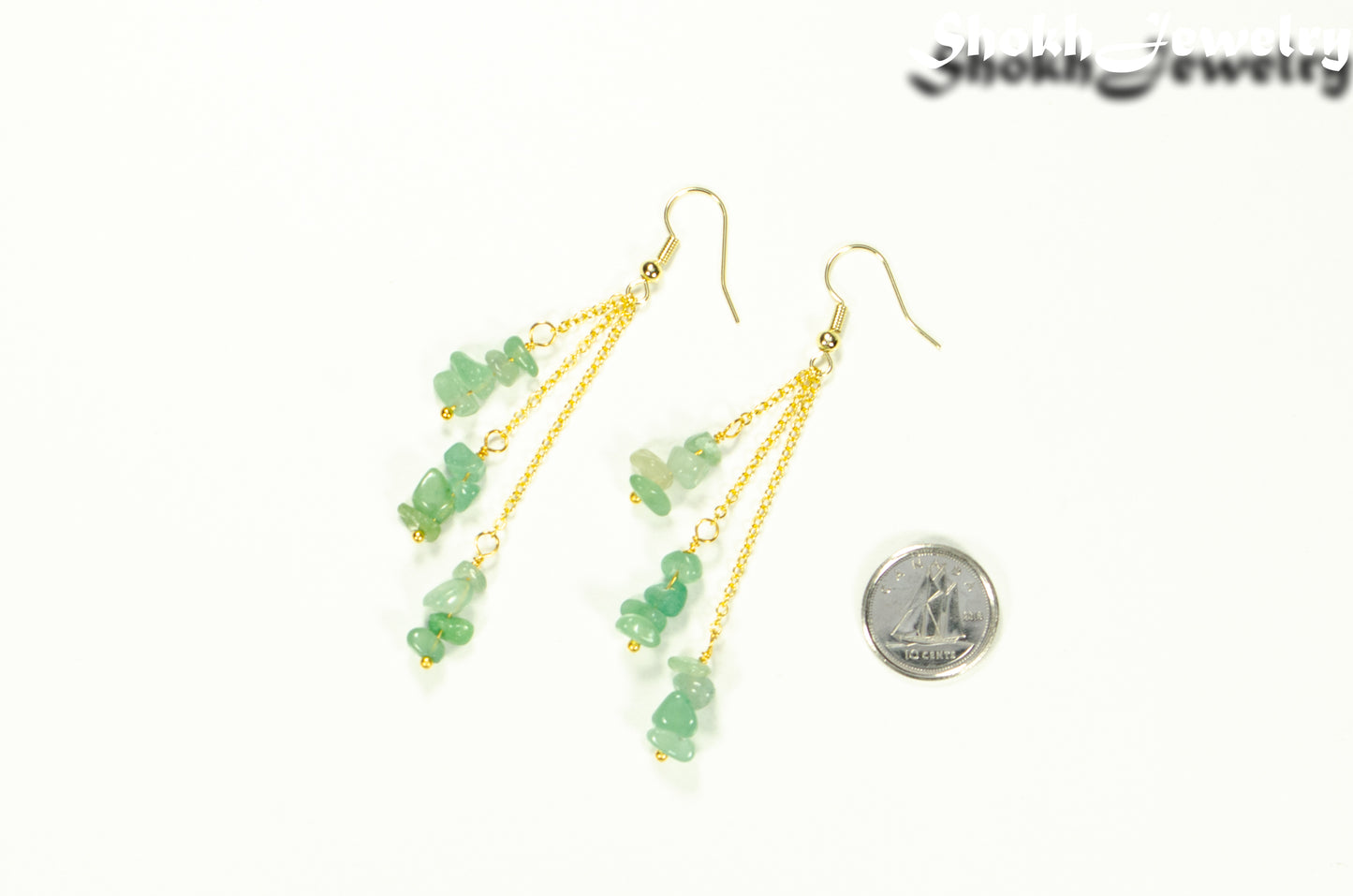 Long Gold Plated Chain and Green Aventurine Chip Earrings beside a dime.
