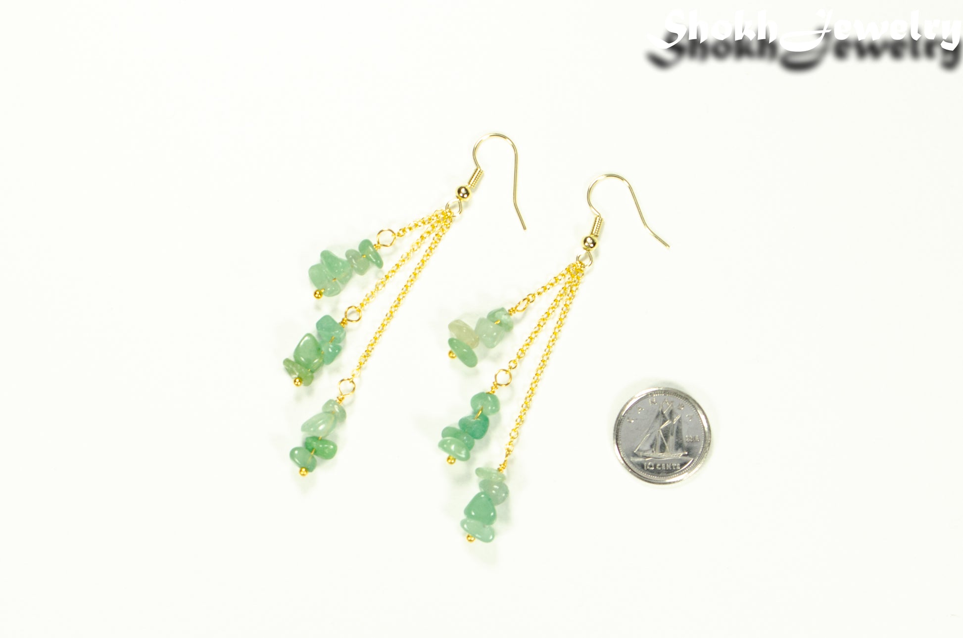 Long Gold Plated Chain and Green Aventurine Chip Earrings beside a dime.
