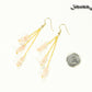 Long Gold Plated Chain and Rose Quartz Crystal Chip Earrings beside a dime.