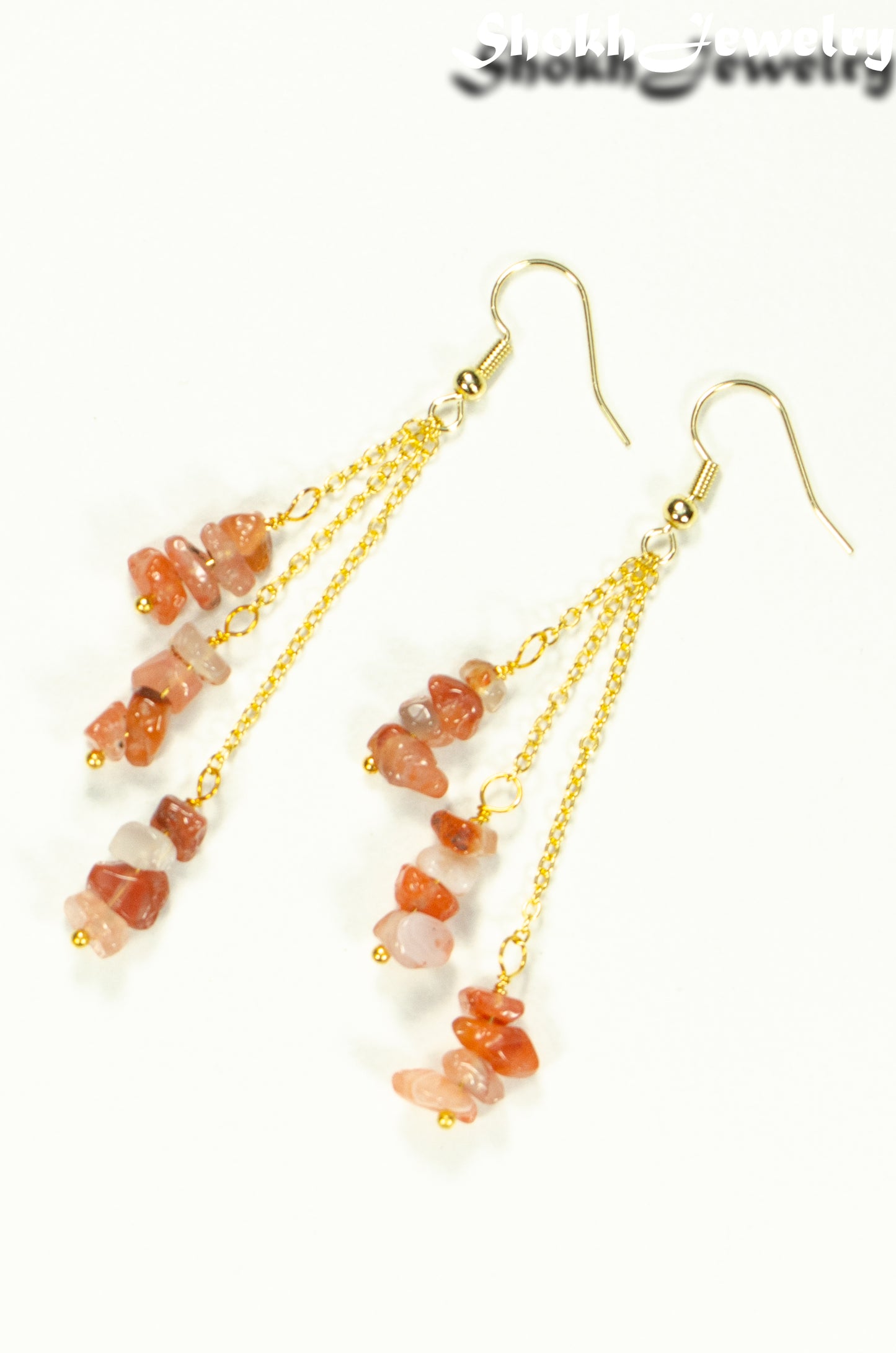 Top view of Long Gold Plated Chain and Carnelian Crystal Chip Earrings.