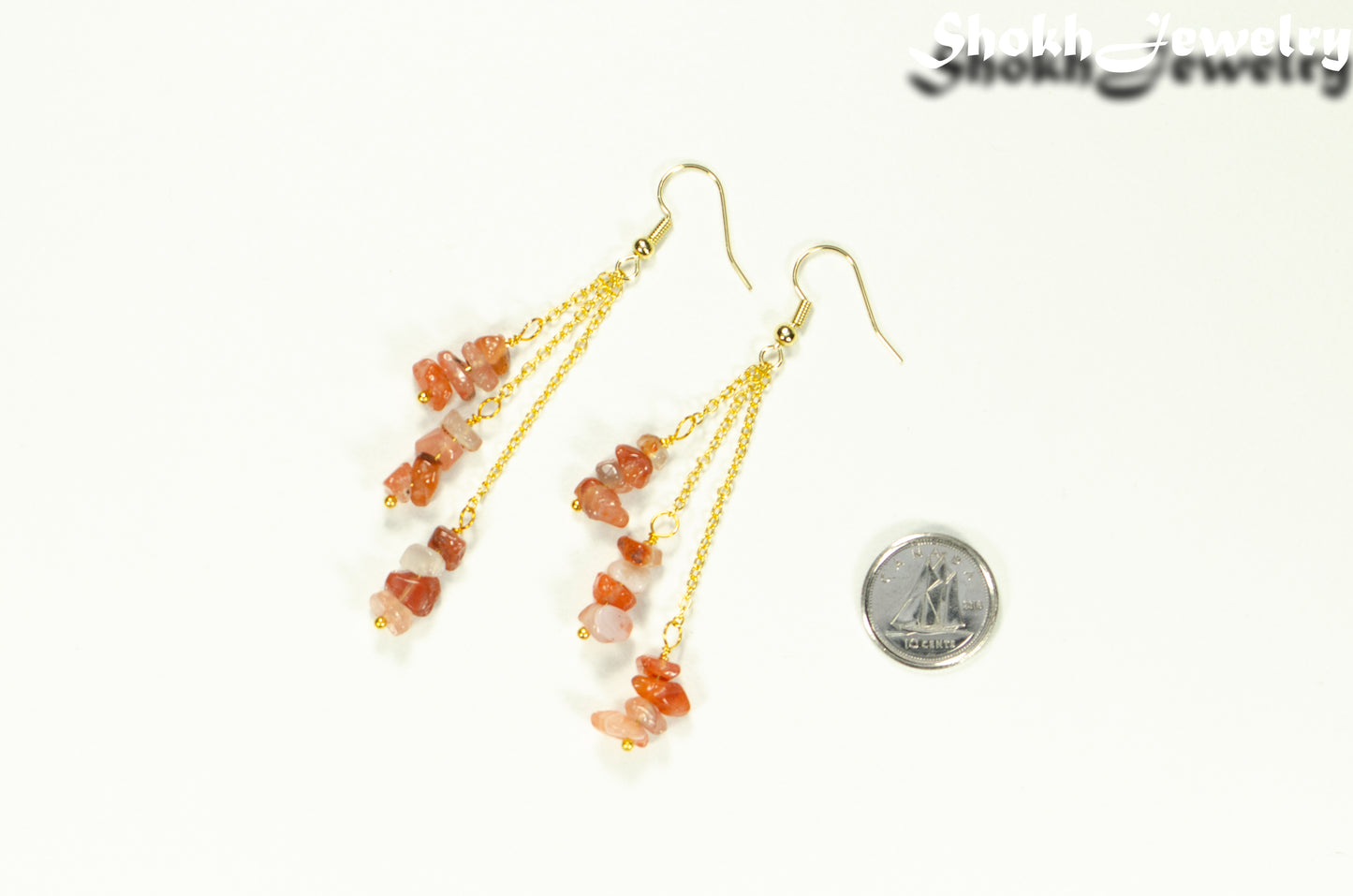 Long Gold Plated Chain and Carnelian Crystal Chip Earrings beside a dime.