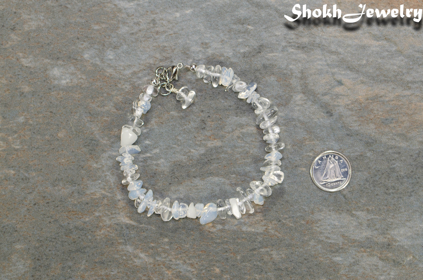 Natural White Opal Crystal Chip Bracelet  beside a dime.