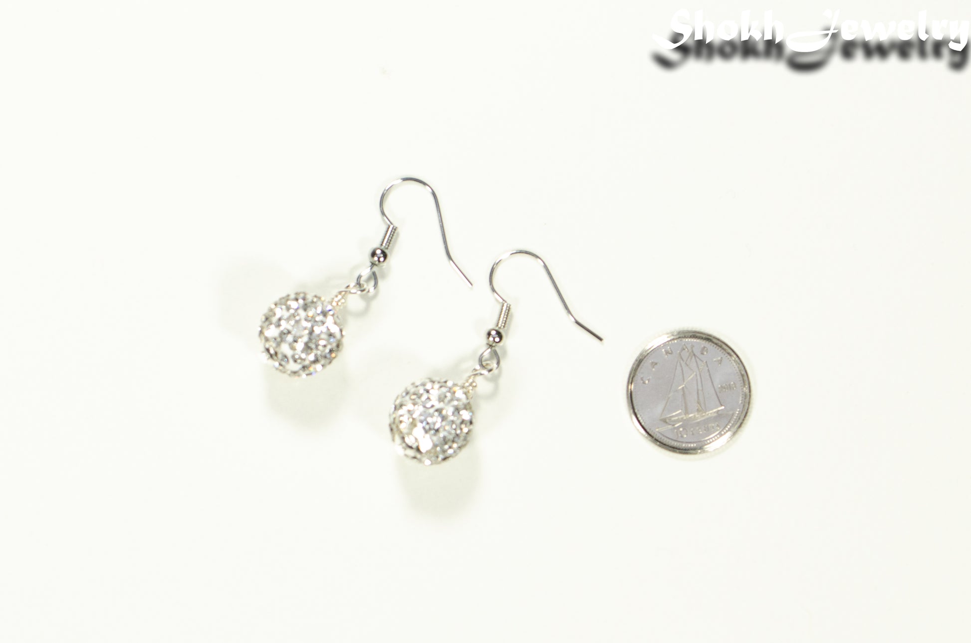 12mm Rhinestone Disco Ball Earrings beside a dime.