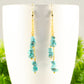 Close up of Long Gold Plated Chain and Turquoise Crystal Chip Earrings.