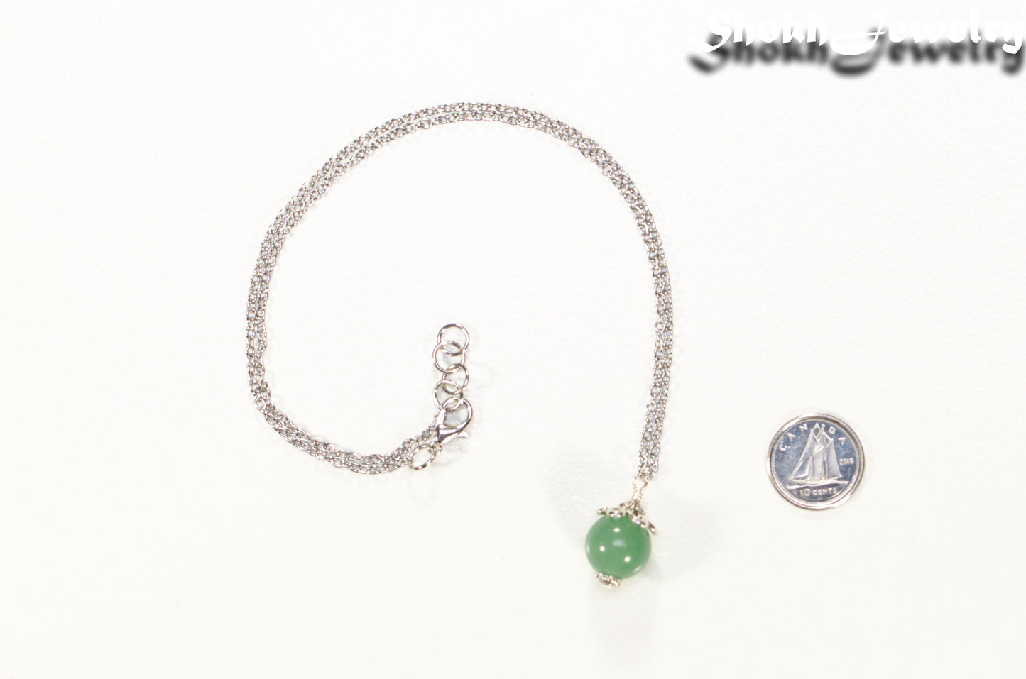 12mm Green Aventurine Pendant Necklace beside a dime.