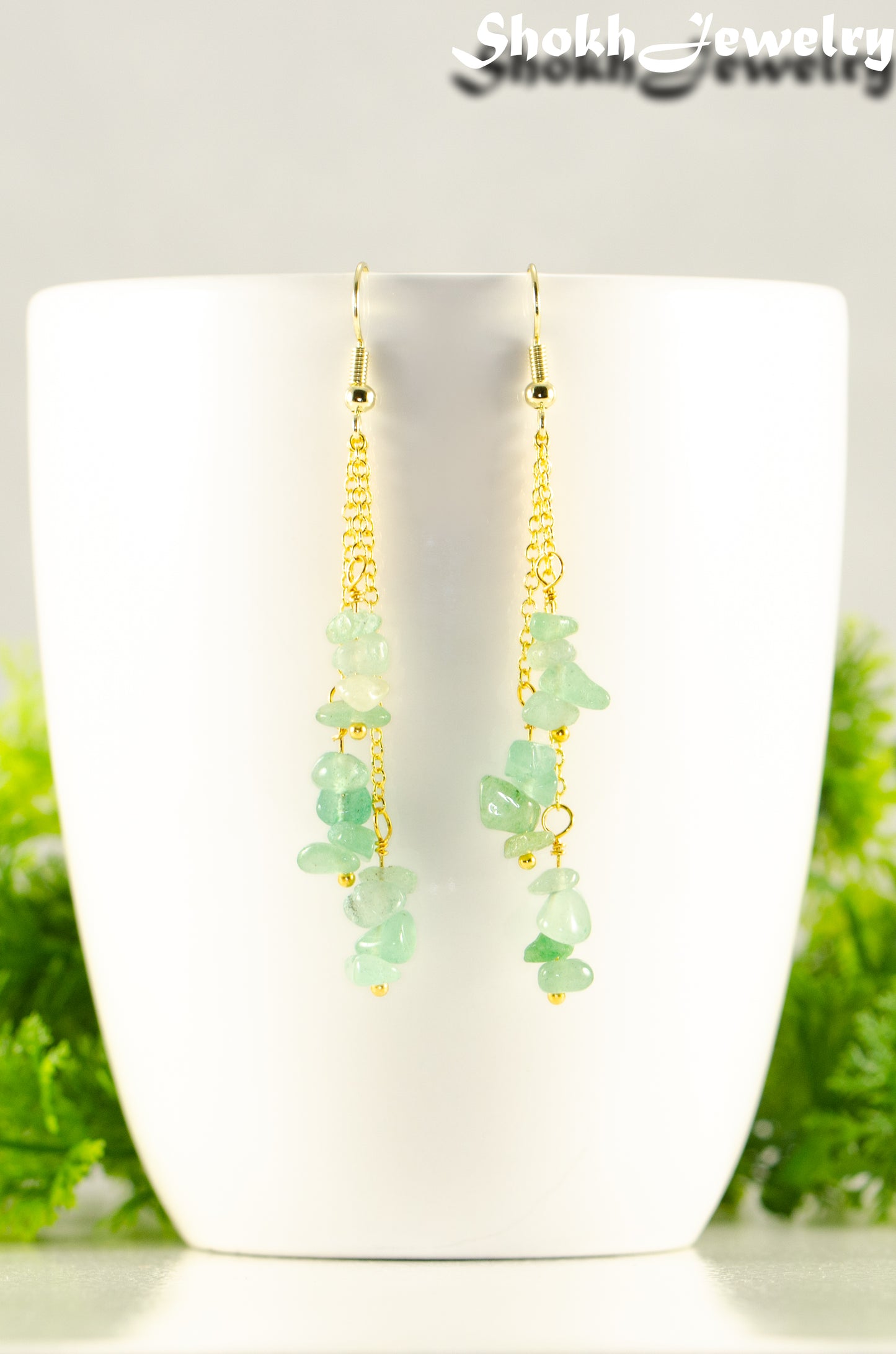 Close up of Long Gold Plated Chain and Green Aventurine Chip Earrings.