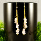 Close up of Long Gold Plated Chain and Rose Quartz Crystal Chip Earrings.