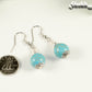 12mm Turquoise Howlite Dangle Earrings beside a dime.