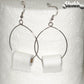 Large Miniature Toilet Paper Roll Earrings displayed  on a toilet paper roll.