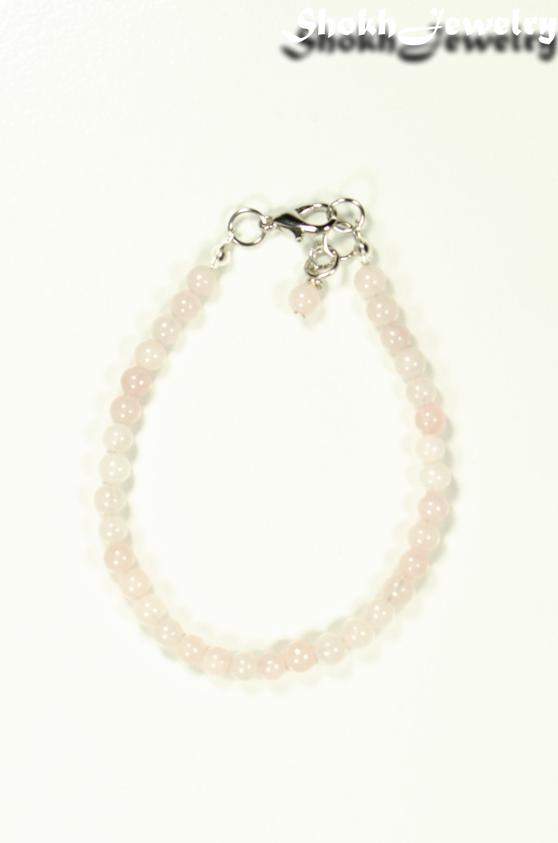 Top view of 4mm Rose Quartz Bracelet with Clasp.