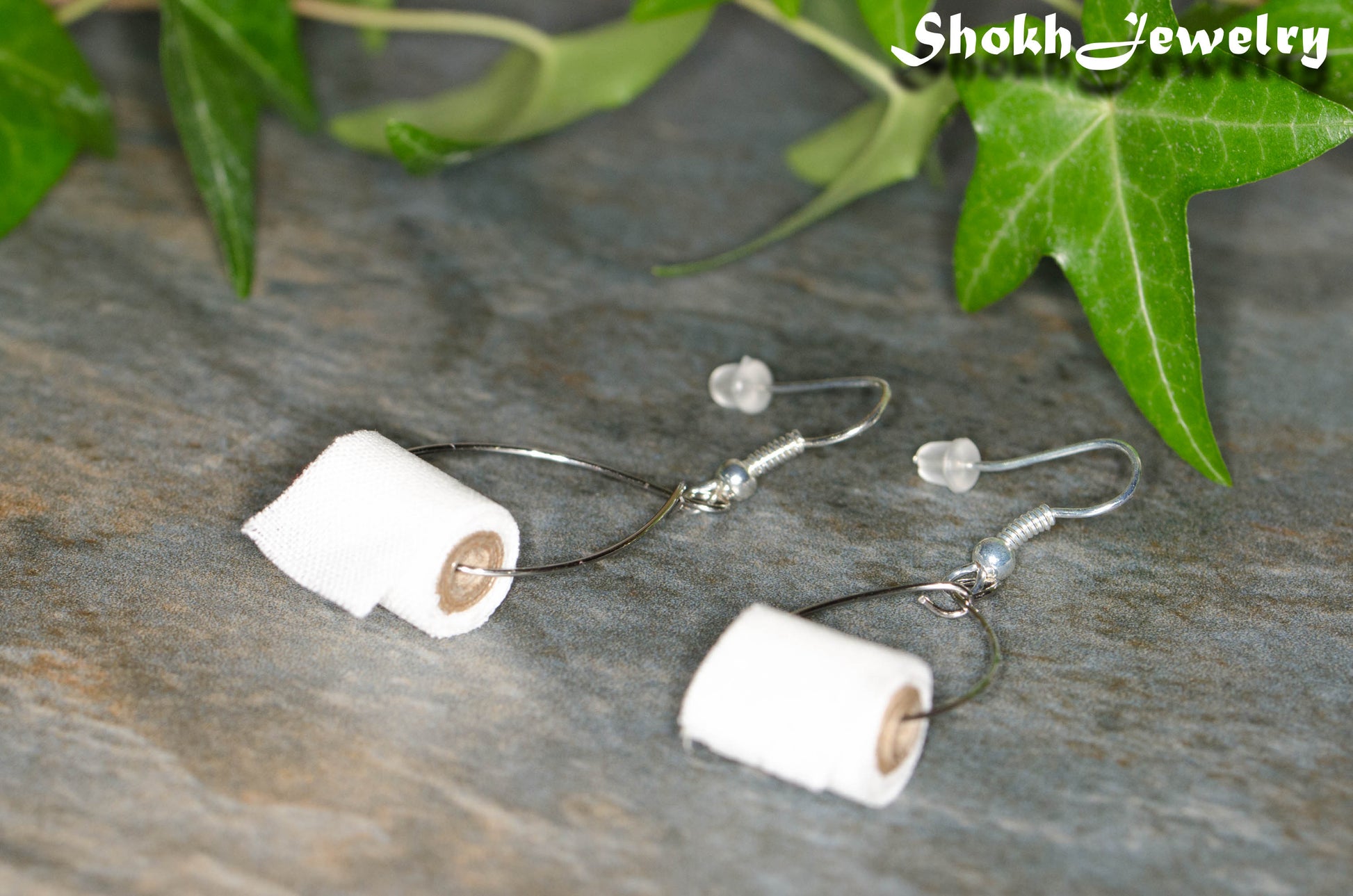 Close up of Miniature Toilet Paper Roll Earrings.