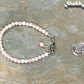4mm Rose Quartz Bracelet with Clasp beside a dime.
