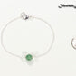 Minimal Green Aventurine Bracelet beside a dime.