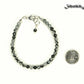 4mm Snowflake Obsidian Stone Bracelet with Clasp beside a dime.