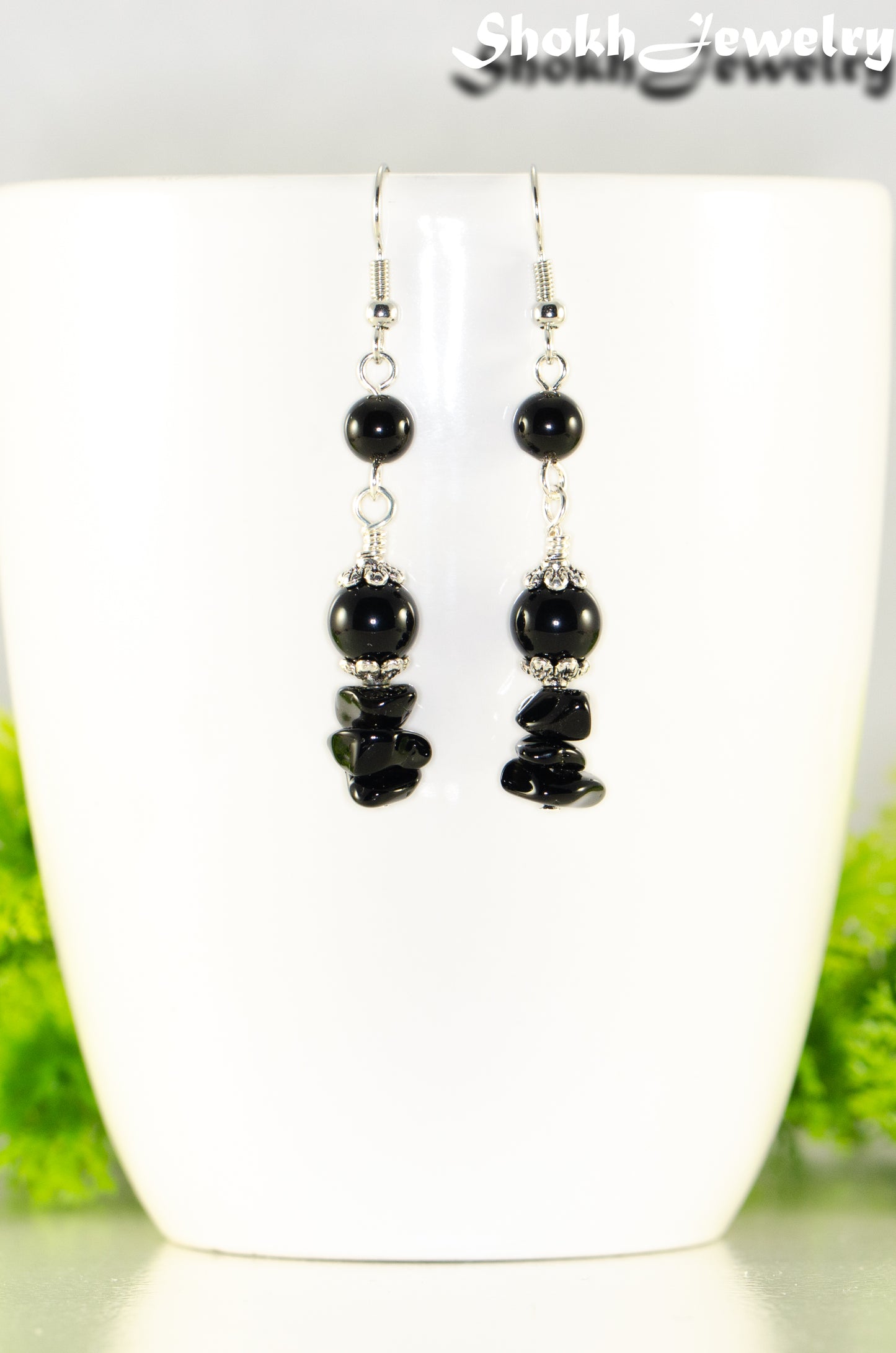 Close up of Long Black Obsidian Crystal Chip Earrings.