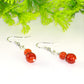 Close up of Small Natural Fire Agate Earrings.