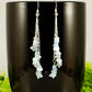 Long Silver Plated Chain and Aquamarine Crystal Chip Earrings on a mug