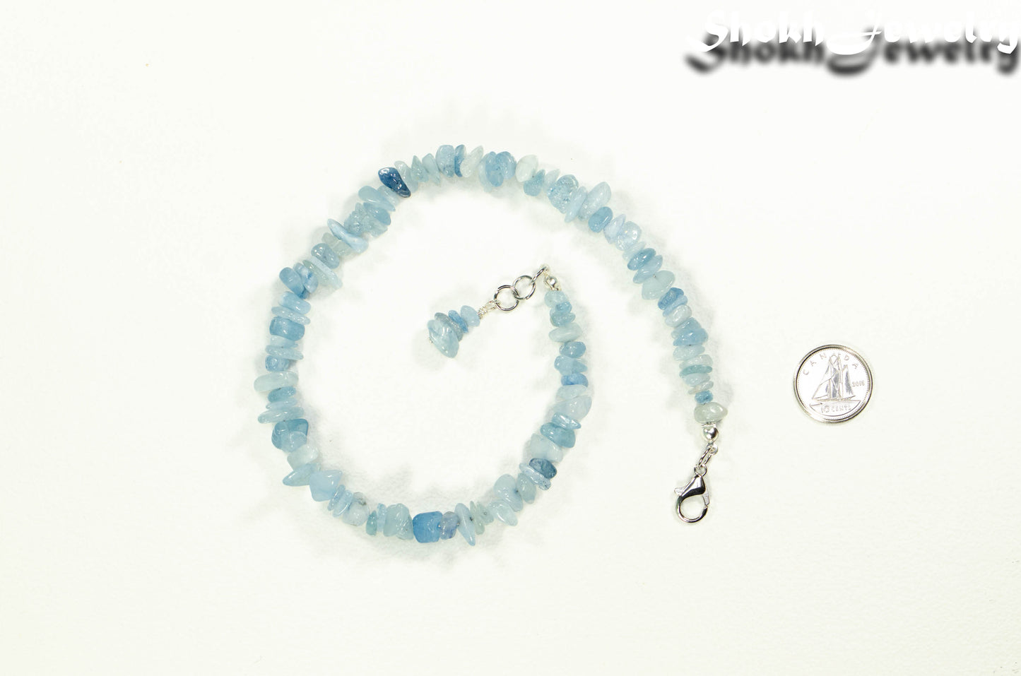 Natural Aquamarine Crystal Chip Anklet beside a dime