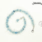 Natural Aquamarine Crystal Chip Choker Necklace beside a dime