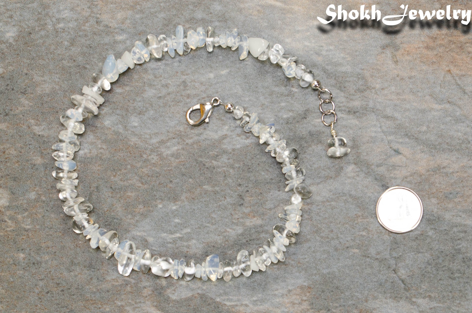 Natural Opal Crystal Chip Choker Necklace beside a dime