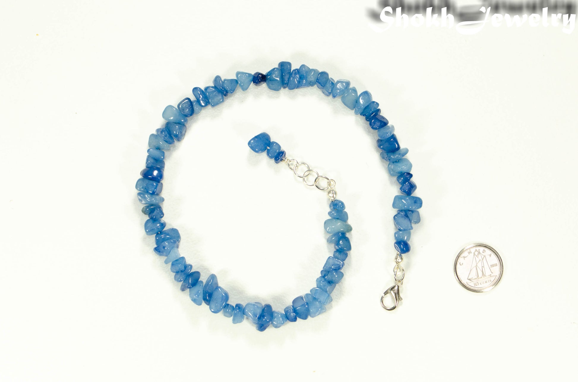 Natural Blue Quartzite Crystal Chip Anklet beside a dime.